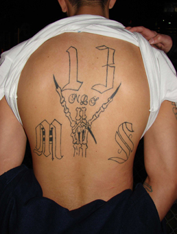 An Mara Salvatrucha member arrested in the Houston salon robbery and extortion plot displays the gang affiliation tattoo